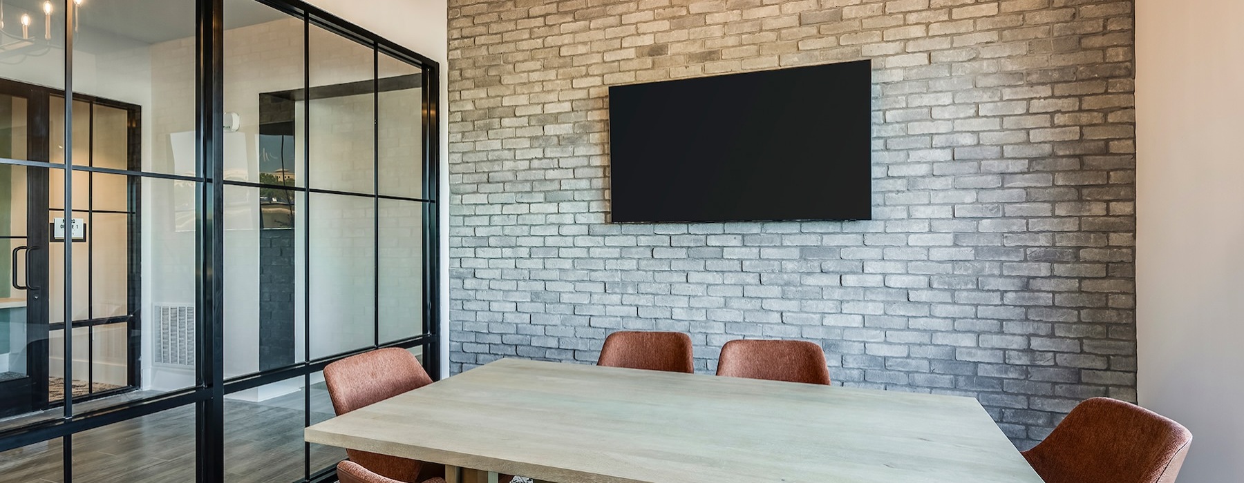 conference room with table seating and tv